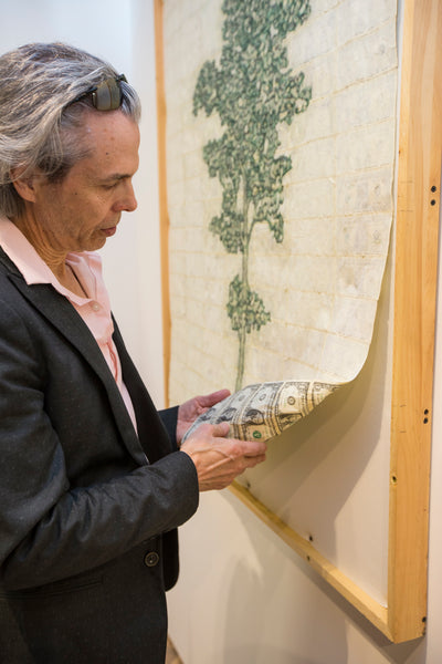 Artist Robin Clark showing the reverse side of One Tree Cannot Make a Forest 02